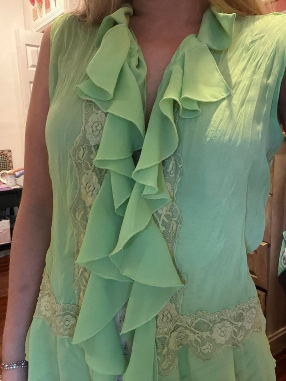 green unique frilly sleeveless button down blouse with ruffles and floral lace